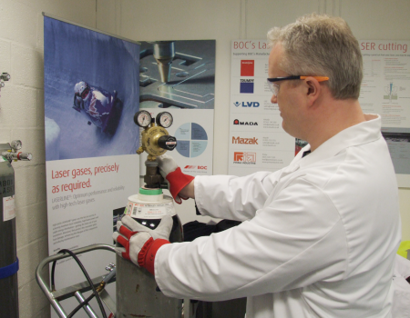 Man connecting a regulator