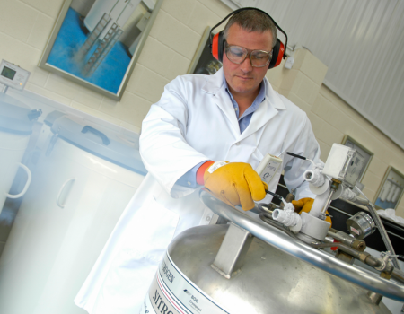Man using liquid nitrogen with PPE