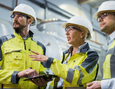 Two men and one women in high vis clothing