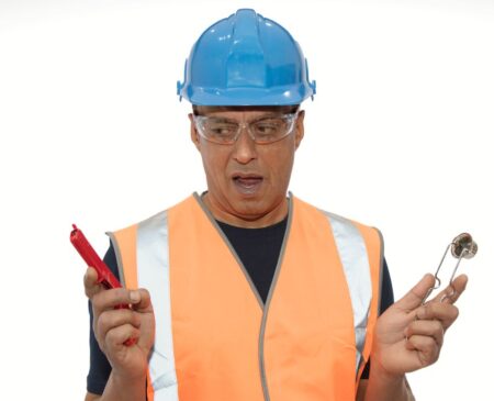 Man in high vis vest and blue hard hat